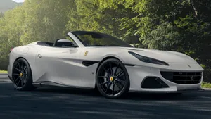 Sleek Red Ferrari Portofino In Stunning Scenery Wallpaper