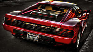 Sleek Red Ferrari Testarossa On Open Road Wallpaper