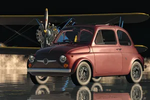 Sleek Red Fiat 500 Parked On A City Street Wallpaper