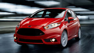 Sleek Red Ford Fiesta On The Go Wallpaper