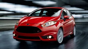 Sleek Red Ford Fiesta On The Go Wallpaper