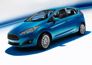 Sleek Red Ford Fiesta On The Open Road Wallpaper