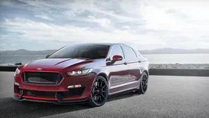 Sleek Red Ford Taurus On Display Wallpaper