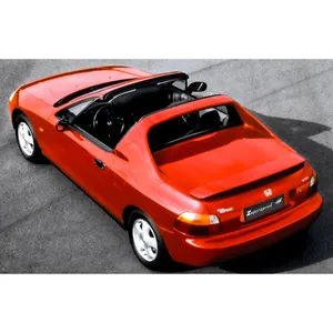 Sleek Red Honda Civic Del Sol In Natural Setting Wallpaper