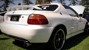 Sleek Red Honda Civic Del Sol In Nature Wallpaper