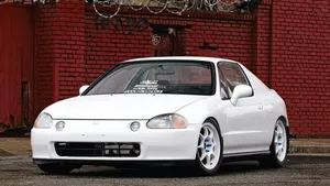 Sleek Red Honda Civic Del Sol In Open Road Wallpaper