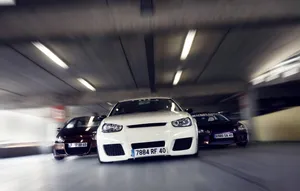 Sleek Red Honda Civic Del Sol In Stunning Cityscape Wallpaper