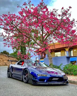 Sleek Red Honda Nsx In Action Wallpaper