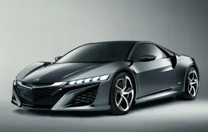 Sleek Red Honda Nsx In Action Wallpaper