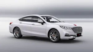 Sleek Red Hongqi Luxury Vehicle In Action Wallpaper