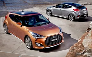 Sleek Red Hyundai Veloster In The City Wallpaper