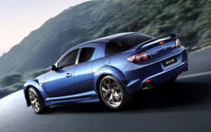 Sleek Red Mazda Rx-8 In Action Wallpaper