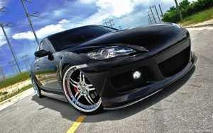 Sleek Red Mazda Rx-8 Sports Car Wallpaper