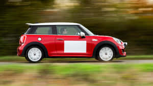 Sleek Red Mini Cooper S On The Road Wallpaper