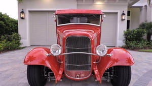 Sleek Red Old Ford Truck Wallpaper