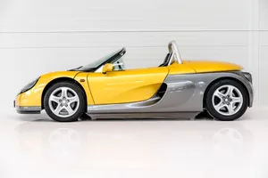 Sleek Red Renault Sport Spider On The Road Wallpaper