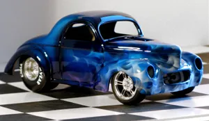 Sleek Red Sports Car On Open Road Wallpaper