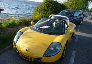 Sleek Renault Sport Spider On Open Road Wallpaper