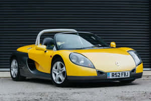 Sleek Renault Sport Spider On The Open Road Wallpaper