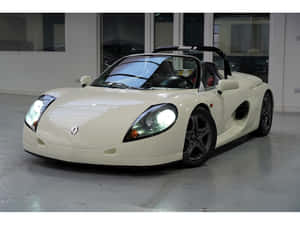Sleek Renault Sport Spider On The Road Wallpaper