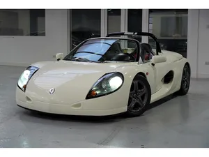 Sleek Renault Sport Spider On The Road Wallpaper