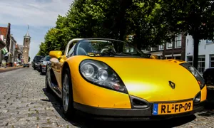 Sleek Renault Sport Spider On The Road Wallpaper