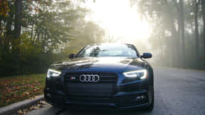 Sleek Silver Audi S5 In Action Wallpaper