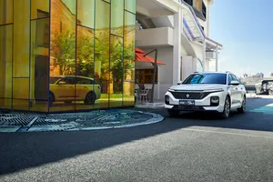 Sleek Silver Baojun Car Parked Under A Blue Sky Wallpaper