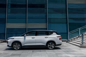 Sleek Silver Baojun Sedan Cruising On The Open Road Wallpaper