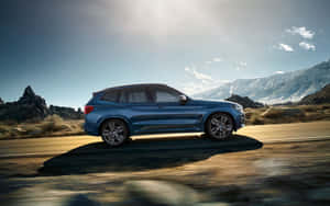 Sleek Silver Bmw X3 On The Open Road Wallpaper