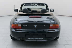 Sleek Silver Bmw Z3 Roadster Parked On A Scenic Roadway Wallpaper