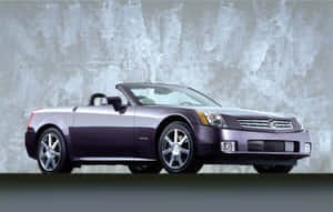 Sleek Silver Cadillac Xlr Cruising In Style Wallpaper