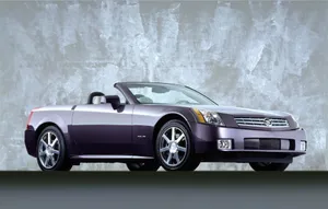 Sleek Silver Cadillac Xlr Cruising In Style Wallpaper