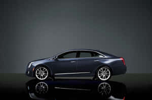 Sleek Silver Cadillac Xts Driven In Style Wallpaper