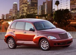 Sleek Silver Chrysler Pt Cruiser On The Road Wallpaper