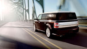 Sleek Silver Ford Flex On Scenic Mountain Road Wallpaper