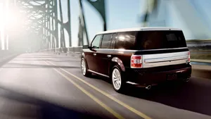 Sleek Silver Ford Flex On Scenic Mountain Road Wallpaper