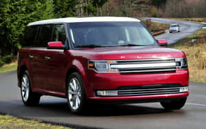 Sleek Silver Ford Flex Suv In Action Wallpaper