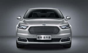 Sleek Silver Ford Taurus On The Road Wallpaper