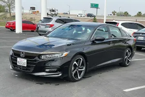 Sleek Silver Honda Accord Parked On The Street Wallpaper