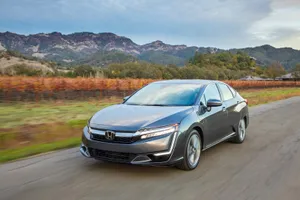 Sleek Silver Honda Clarity On The Road Wallpaper