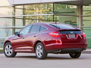 Sleek Silver Honda Crosstour In A Serene Outdoor Setting Wallpaper