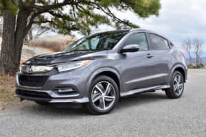 Sleek Silver Honda Hr-v On The Road Wallpaper