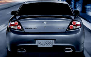 Sleek Silver Hyundai Tiburon On The Open Road Wallpaper