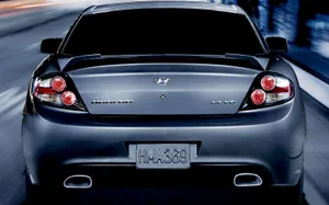 Sleek Silver Hyundai Tiburon On The Open Road Wallpaper