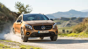 Sleek Silver Mercedes Benz Gla-class Parked On An Urban Street Wallpaper