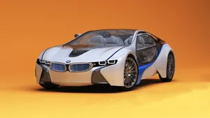 Sleek Silver Sports Car In Action Wallpaper