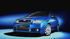 Sleek Skoda Fabia Gliding On Suburban Road Wallpaper