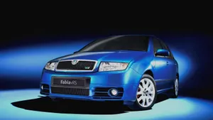 Sleek Skoda Fabia Gliding On Suburban Road Wallpaper