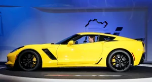 Sleek Sports Car In A Stunning Landscape Wallpaper